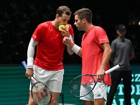 Vasek Pospisil (left) and Alexis Galarneau of Canada in action during the 2023 Davis Cup Finals Group Stage.