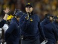 Michigan head coach Jim Harbaugh gestures toward a referee during a game earlier this season.