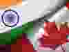 Canada and India flag together realtions textile cloth fabric texture.