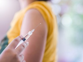 Closeup of doctor hand are vaccinations to patients using the syringe.Medical concept