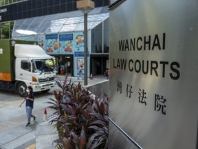 The sign for the Wan Chai District Court where the sentence for four former University of Hong Kong student leaders were handed down in Hong Kong, Monday, Oct. 30, 2023.