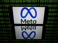 This picture taken on January 12, 2023 in Toulouse, southwestern France shows a tablet displaying the logo of the company Meta.