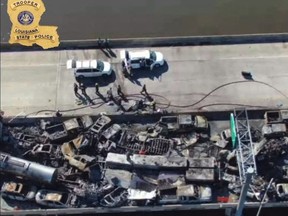 This still image obtained from a handout video released by the Lousiana State Police on Facebook shows burned vehicles after a fire erupted following a crash on Interstate 55 highway in St. John the Baptist Parish, Louisiana, on October 23, 2023.
