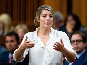 Mélanie Joly, Minister of Foreign Affairs, rises during Question Period on Parliament Hill in Ottawa, on Thursday, Oct. 5, 2023. Foreign Affairs Minister Mélanie Joly says Ottawa is planning to airlift Canadian citizens, permanent residents, their spouses and their children out of Tel Aviv in "the coming days," as conflict between Israel and Hamas escalates.