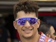 FILE - Kansas City Chiefs quarterback Patrick Mahomes arrive before the start of the Formula One Miami Grand Prix at the Miami Miami International Autodrome in Miami Gardens, Fla., Sunday, May 7, 2023. Patrick Mahomes said Wednesday, Oct. 18, 2023, that he "jumped" at the the chance to invest in a Formula One team when he was asked to join a group of celebrity backers behind the Alpine team.