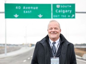 Airdrie's mayor Peter Brown stands in front of the Highway 2 bridge and interchange which was opened to the public on Friday Oct. 13, 2023.
