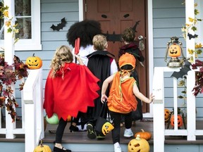 Young kids trick or treating during Halloween.