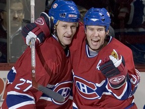 Montreal Canadiens' Alex Kovalev (left) is hugged by teammate Craig Rivet.