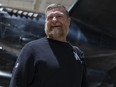 Winnipeg Blue Bombers head coach Mike O'Shea smiles as he leaves the Canadian Warplane Heritage Museum in Hamilton, Ont..