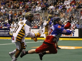 Toronto Rock’s Josh Sanderson gets off a flying shot during a game in 2015.