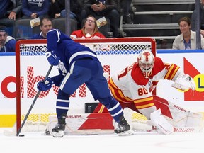 Toronto Maple Leafs left winger Mitch Marner scores a shootout goal on Calgary Flames goaltender Dan Vladar