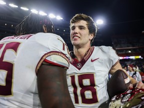 Tate Rodemaker #18 of the Florida State Seminoles looks on after a game against the Florida Gators at Ben Hill Griffin Stadium on November 25