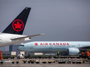 Air Canada planes are parked at Toronto Pearson Airport in Mississauga, Ont., April 28, 2021.