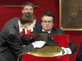 Napoleon's hat is set up prior to its auction in Fontainebleau, South of Paris, Sunday Nov. 16, 2014. Napoleon Bonaparte's famous bicorn hat was sold 1.5 million euros, $1,930,000. One of Napoleon Bonaparte's famous hats was among over 1,000 items relating to the French general that were auctioned near Paris this weekend.