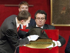 Napoleon's hat is set up prior to its auction in Fontainebleau, South of Paris, Sunday Nov. 16, 2014. Napoleon Bonaparte's famous bicorn hat was sold 1.5 million euros, $1,930,000. One of Napoleon Bonaparte's famous hats was among over 1,000 items relating to the French general that were auctioned near Paris this weekend.