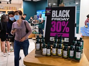 People shop during Black Friday in Santa Anita within the city of Arcadia, California on November 25, 2022.