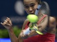 Canada's Leylah Fernandez returns the ball against Italy's Jasmine Paolini during the final singles tennis match between Italy and Canada on the last day of the Billie Jean King Cup Finals 2023 in La Cartuja stadium in Seville on November 12, 2023.