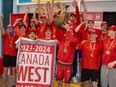 Calgary Dinos Hoist the Canada West Swimming Finals banner