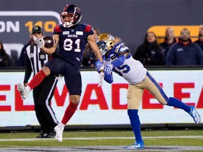 Montreal Alouettes wide receiver Austin Mack (81) makes a catch as he's tackled by Winnipeg Blue Bombers defensive back Demerio Houston (35) during the second half of football action at the 110th CFL Grey Cup in Hamilton, Ont., on Sunday, November 19, 2023.