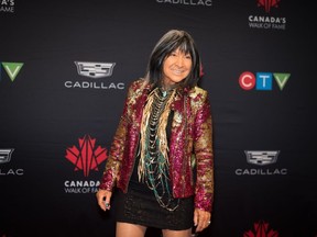 A documentary about folk legend Buffy Sainte-Marie, made before her Indigenous ancestry was called into question, has won an International Emmy Award. Award-winning singer-songwriter Buffy Sainte-Marie poses for a photograph on the red carpet for the 2022 Canada's Walk of Fame Gala in Toronto, on Saturday, December 3, 2022.