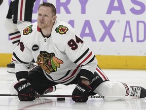 Chicago Blackhawks right wing Corey Perry (94) warms up before an NHL hockey game against the Nashville Predators, Saturday, Nov. 18, 2023, in Nashville, Tenn. (AP Photo/George Walker IV)