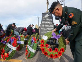 People attend the Remembrance Day ceremony at The Military Museums in Calgary on Saturday, Nov. 11, 2023.