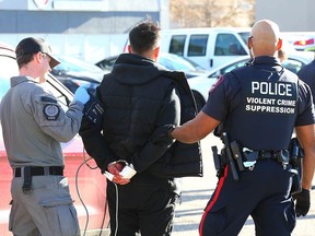 One man is shown in Calgary Police custody following a shootout in the community of Falconridge on October 18, 2023 that's under ASIRT investigation.