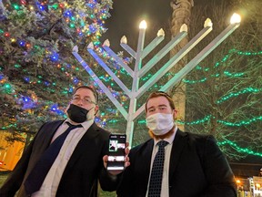 This file photo from December, 2020, shows the Hanukkah Menorah at Moncton City Hall being lit in a ceremony by Rabbi Yitzhchok Yagod and his son Rabbi Pinchas Yagod.