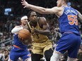 Toronto Raptors forward O.G. Anunoby is guarded by New York Knicks centre Isaiah Hartenstein.