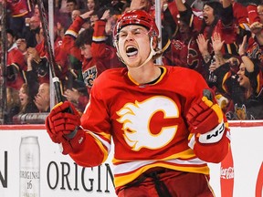 Connor Zary of the Calgary Flames celebrates after scoring agaisnt the Tampa Bay Lightning.