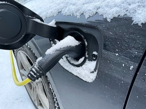 Electric vehicle being charged