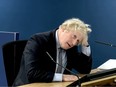 A video grab from footage broadcast by the UK Covid-19 Inquiry shows Britain's former Prime Minister Boris Johnson speaking at the UK Covid-19 Inquiry, in west London, on December 6, 2023 to give evidence.
