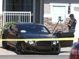 Calgary police investigate at the scene of a shooting in the 100 block of Everwoods Court S.W. in Calgary on Thursday, August 18, 2022.