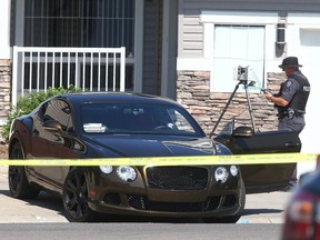 Calgary police investigate at the scene of a shooting in the 100 block of Everwoods Court S.W. in Calgary on Thursday, August 18, 2022.