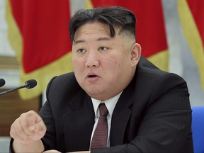 In this photo provided by the North Korean government, North Korean leader Kim Jong Un speaks during a meeting of the Workers' Party of Korea at the party headquarters in Pyongyang, North Korea on, Dec. 30, 2022.