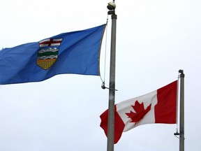 The flags of Alberta and Canada are flown at Syncrude's Beaver Creek Wood Bison Ranch north of Fort McMurray, Alta. on Saturday, June 18, 2022. Vincent McDermott/Fort McMurray Today/Postmedia Network