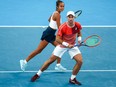 Canada's Steven Diez and Leylah Fernandez play a point against Chile's Tomas Barrios Vera and Daniela Seguel during their mixed-doubles match at the United Cup tennis tournament on Ken Rosewall Arena in Sydney on Dec. 31, 2023.