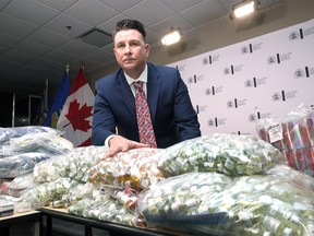 Evidence of a money laundering operation, including the illegal manufacturing and sale of anabolic steroids, is pictured at Calgary police headquarters