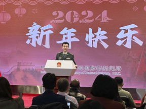 China's Defense Ministry spokesperson Col. Wu Qian speaks to reporters at a monthly briefing in Beijing, Thursday, Dec. 28, 2023. Weeks before Taiwan holds elections for its president and legislature, China renewed its threat to use military force to annex the self-governing island democracy it claims as its own territory.