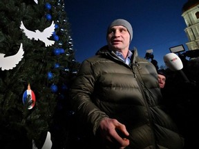 Kyiv mayor Vitali Klitschko talks to the press during the inauguration ceremony of a Christmas tree set up on Kyiv's Saint Sophia Square, Dec. 19, 2022.
