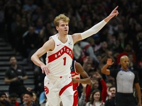 Toronto Raptors guard Gradey Dick celebrates after scoring a three point basket during first half NBA basketball action against the Washington Wizards, in Toronto, Monday, Nov. 13, 2023.