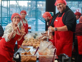 The Christmas Fund helps dozens of local agencies address crucial needs in our city, including hunger. Here, volunteers prepare over 2,000 lunches in the Brown Bagging for Calgary's Kids kitchen in downtown Calgary on Thursday, November 16, 2023. Gavin Young/Postmedia