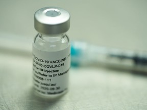 A vial of a plant-derived COVID-19 vaccine candidate, developed by Medicago, is shown in Quebec City on Monday, July 13, 2020.
