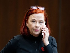 CBC President and CEO Catherine Tait talks on a cellphone before appearing at the Standing Committee on Canadian Heritage in Ottawa, on Thursday, Nov. 2, 2023.