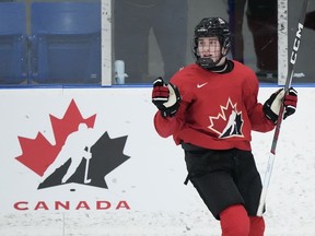 Canada forward Macklin Celebrini celebrate his goal against the U Sports all-stars during first period Canadian World Juniors selection camp hockey action in Oakville, Ont., on Wednesday, Dec. 13, 2023. Celebrini was contemplating his next hockey stop. The teenage star poised to join the U.S. college hockey ranks for the 2023-24 season had plenty of NCAA schools pining for his services back in June 2022.