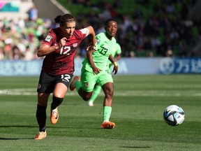 Canada's Christine Sinclair runs with the ball during Group B soccer action against Nigeria at the FIFA Women's World Cup in Melbourne, Australia, Friday, July 21, 2023. A young Sinclair caught the eye of then team coach Even Pellerud in 1999.