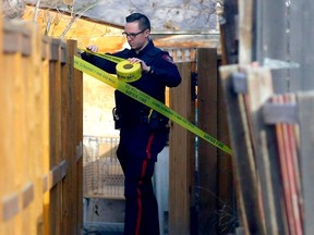Calgary police investigate a shooting in a condo complex at Woodview Terrace S.W. in Calgary on Sunday, November 19, 2023.