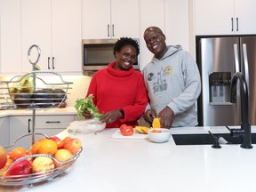 Doris Mulumba-Omondi and Gordon Abongo love living in the community of Wildflower in Airdrie.