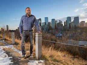 Shaeer Gaidhar, chair of Calgary Inner City Builders Association, overlooks downtown Calgary from the community of Crescent Heights.