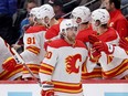 Blake Coleman of the Calgary Flames celebrates with his teammates after scoring against the Colorado Avalanche at Ball Arena on December 11, 2023 in Denver, Colorado.